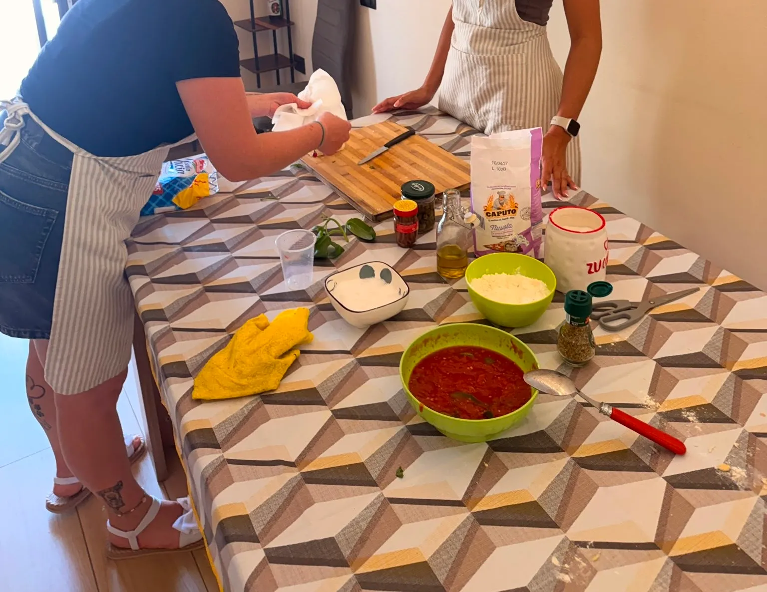Fresh ingredients laid out for a pizza making class near Cagliari — Caputo flour, tomato sauce, mozzarella and basil.