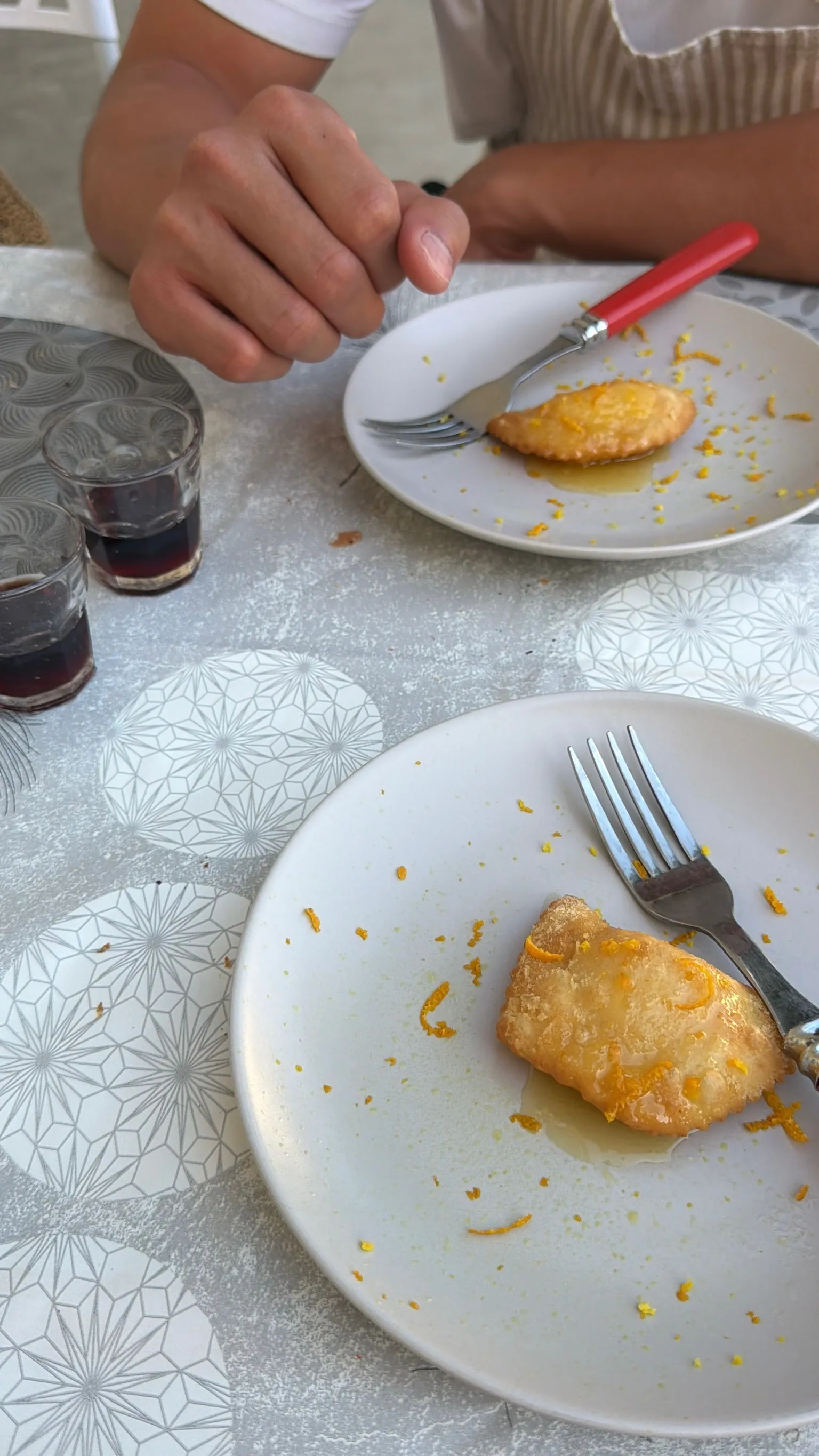 Traditional Sardinian seadas dessert — fried pastry with honey and citrus — served at a pizza making class near Cagliari.